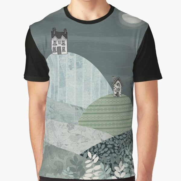 Cozy winter landscape graphic t-shirt featuring a village nestled in hills under a starry night sky