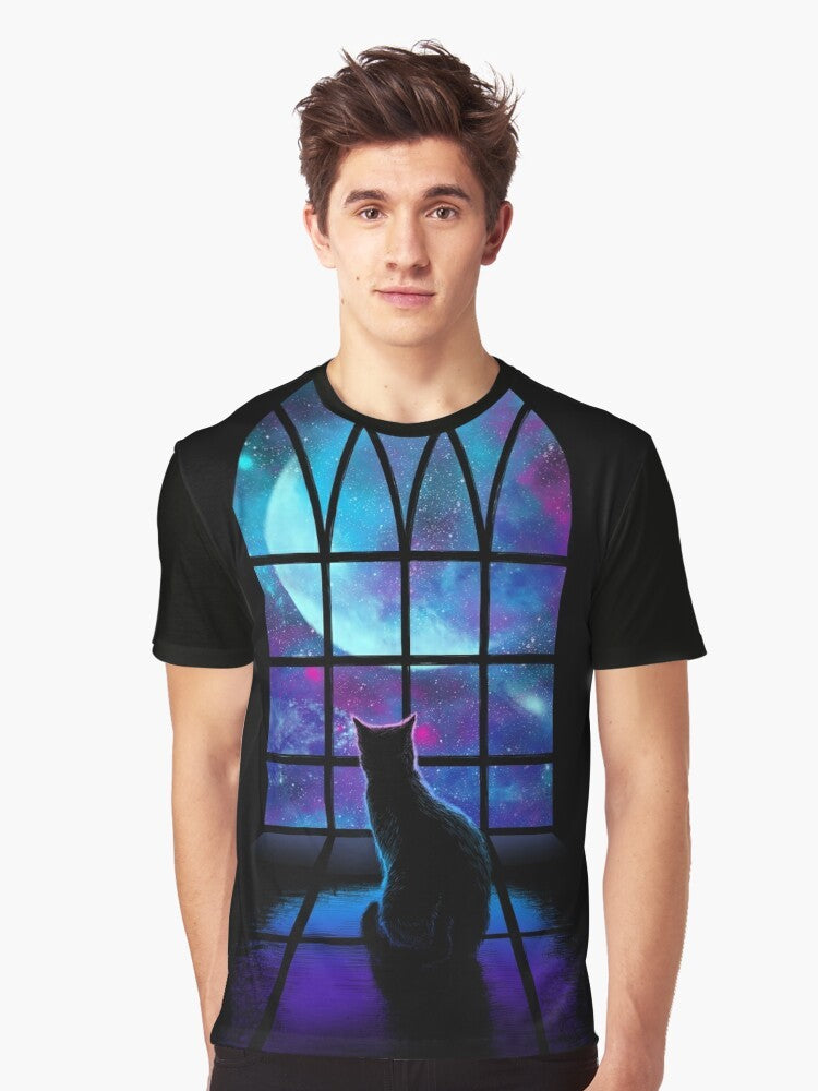 A graphic t-shirt featuring a cute cat in a space-themed design with planets, stars, and the moon. - Men