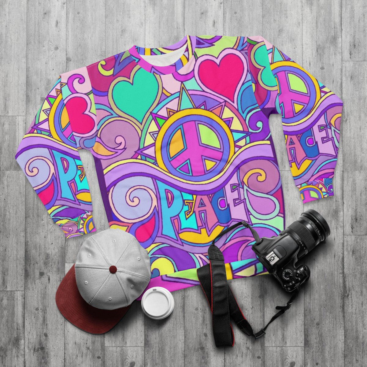 Retro psychedelic peace hippie sweatshirt with colorful abstract 60s/70s graphic - flat lay