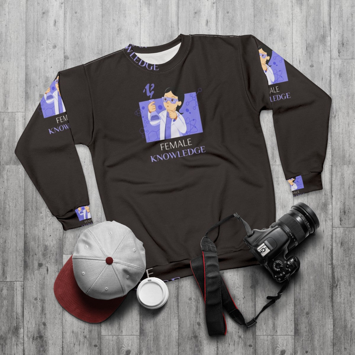 Female scientist in laboratory coat holding a beaker, wearing the "Female Knowledge" science sweatshirt - flat lay