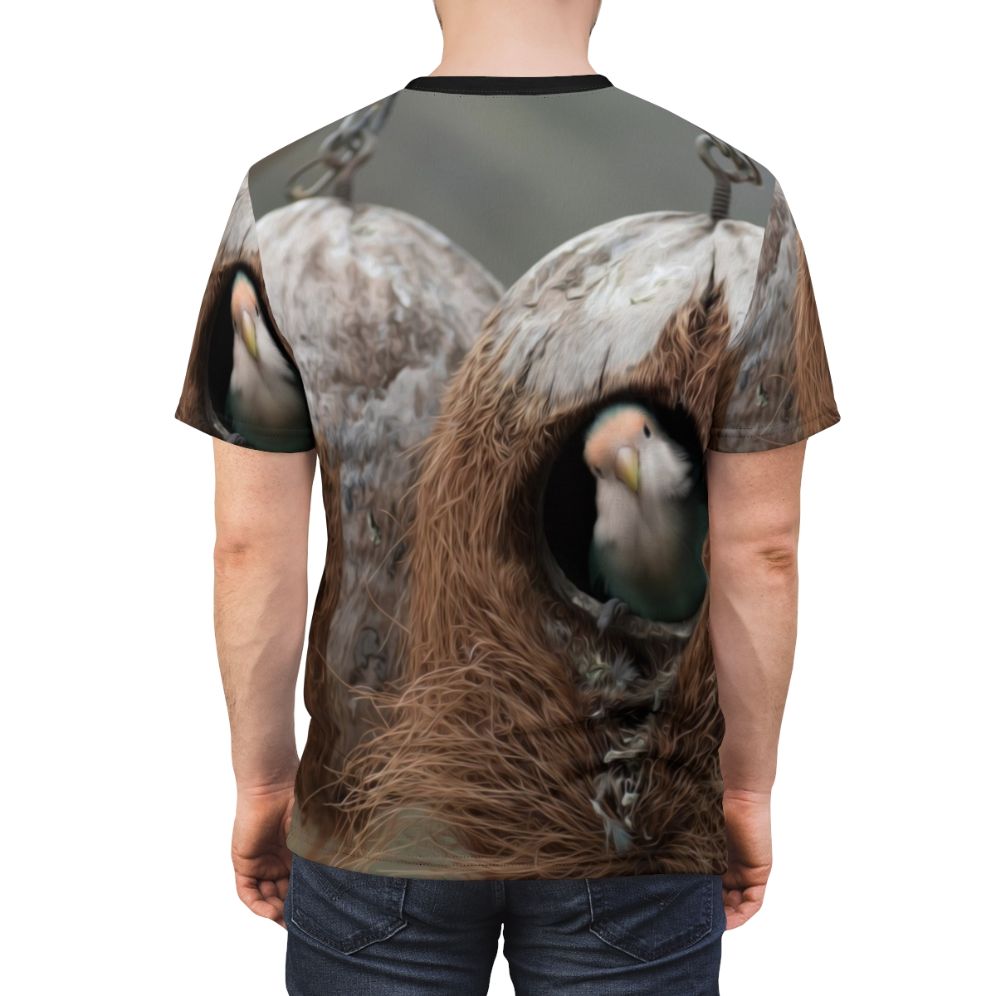 T-shirt featuring a vibrant design of birds, nests, and feathers in a natural landscape. - men back