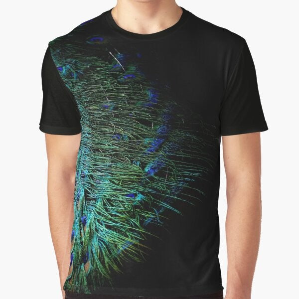 Graphic t-shirt design featuring abstract peacock feathers on a black background, modern aesthetic.