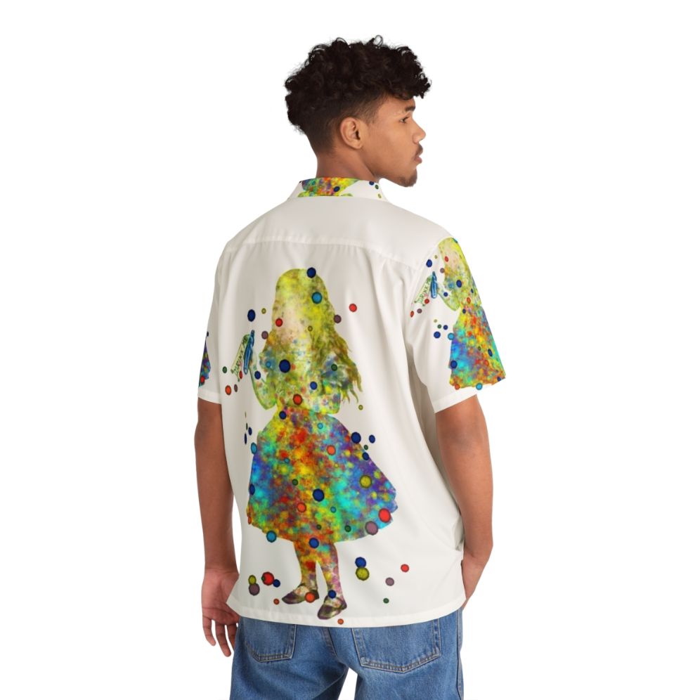 Whimsical Alice in Wonderland watercolor art printed on a colorful Hawaiian shirt - Flat lay