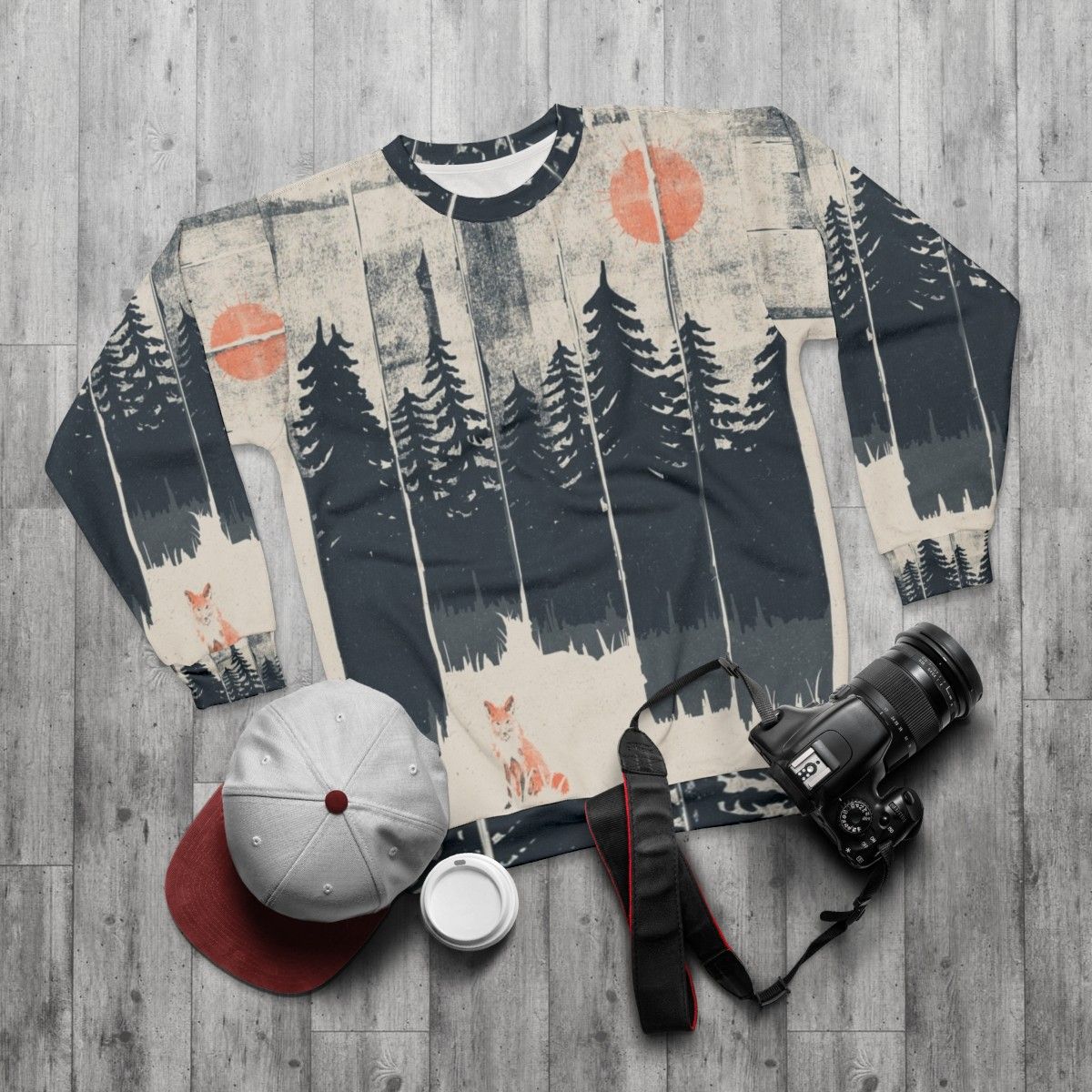 Cozy sweatshirt with a fox design in the wild forest - flat lay