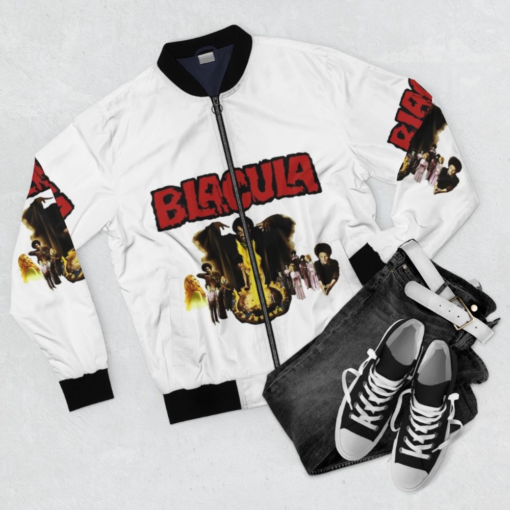 Black and red horror-themed bomber jacket with Blacula-inspired graphic design - Flat lay