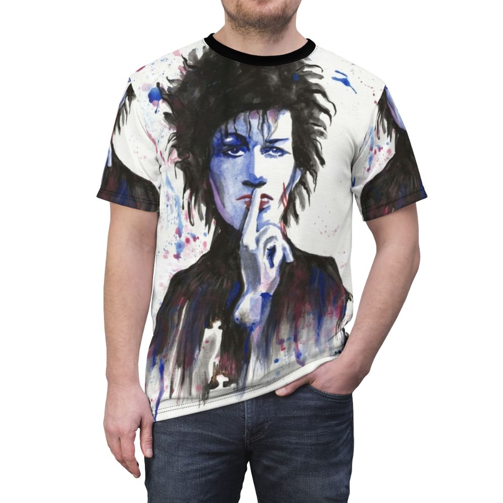 Watercolor-style t-shirt design featuring the image of Daniel Ash, the musician known for his work with the band Bauhaus - men front