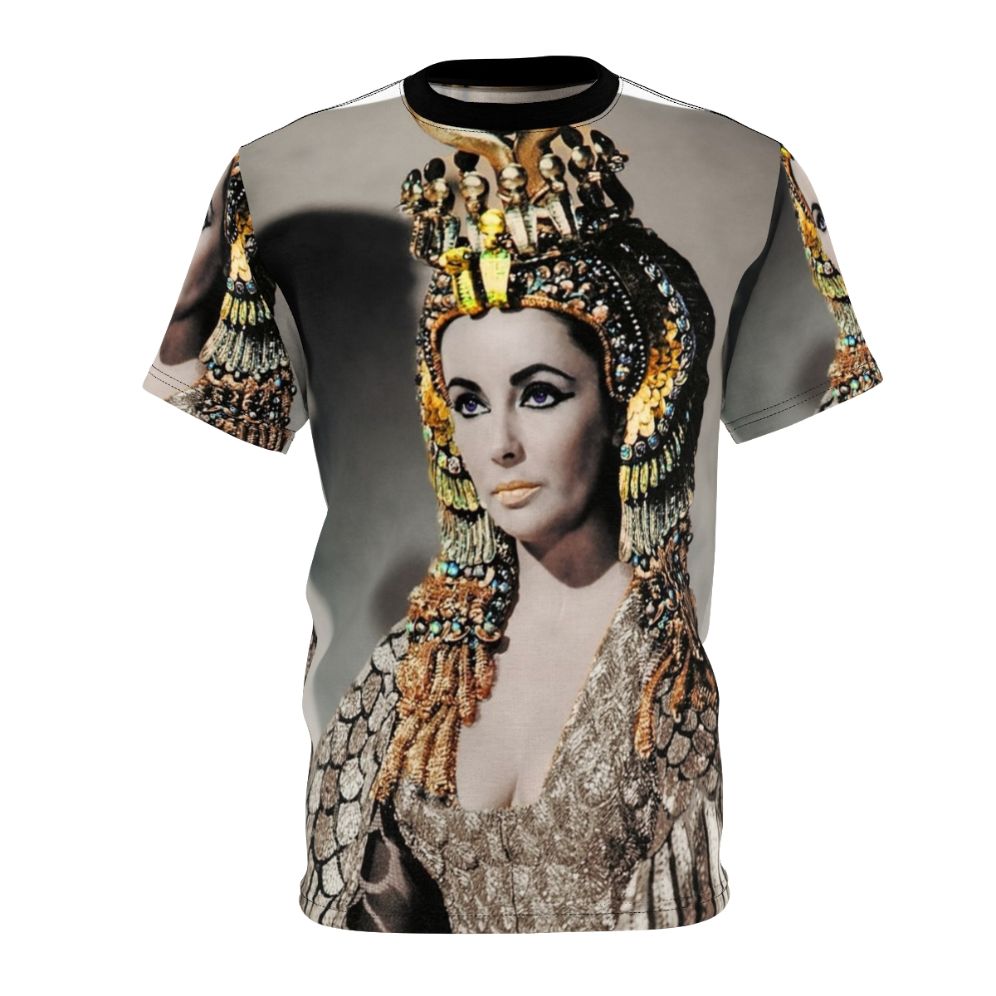 A person wearing a T-shirt featuring a stylized portrait of Elizabeth Taylor as Cleopatra in ancient Egyptian attire.