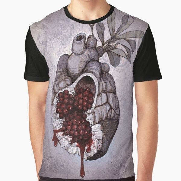 Graphic t-shirt featuring an anatomical illustration of a human heart with pomegranate seeds, inspired by the Greek mythology of Persephone.