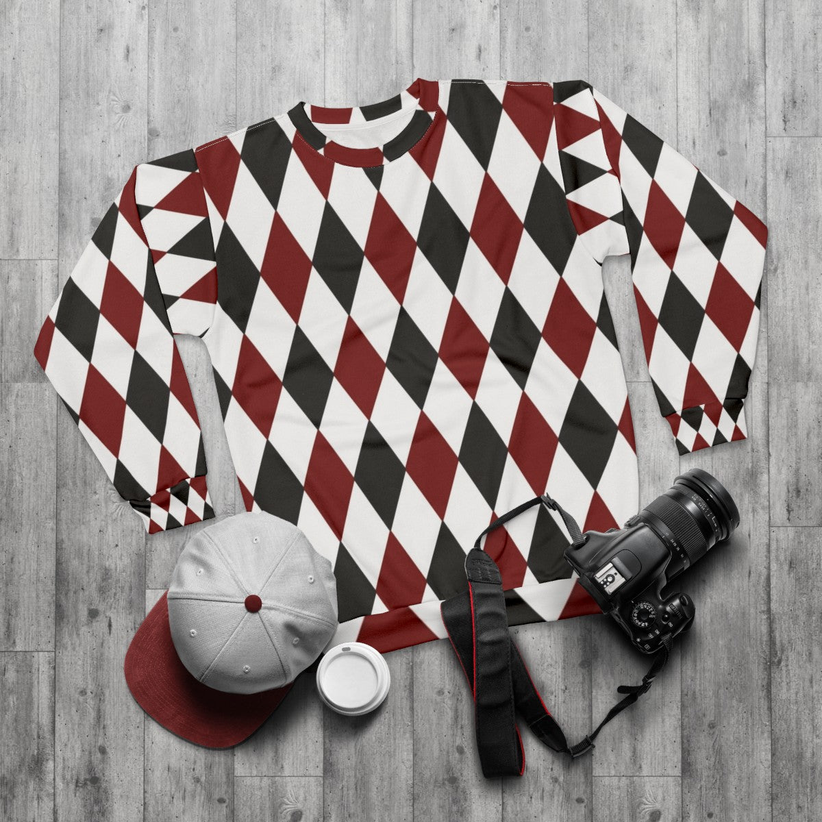 Black, white, and red harlequin diamond pattern sweatshirt - flat lay