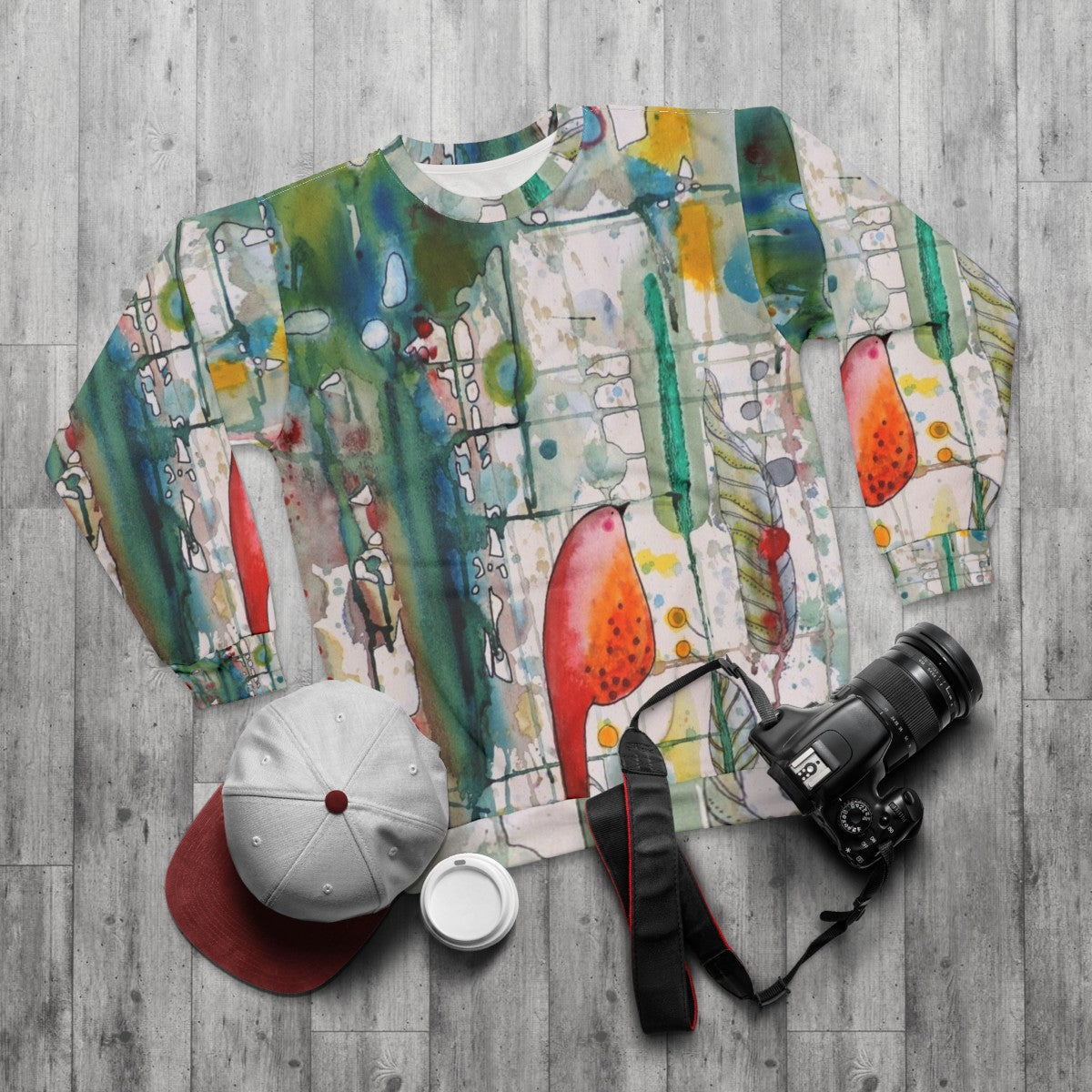 Watercolor bird sweatshirt with forest leaves and feathers - flat lay