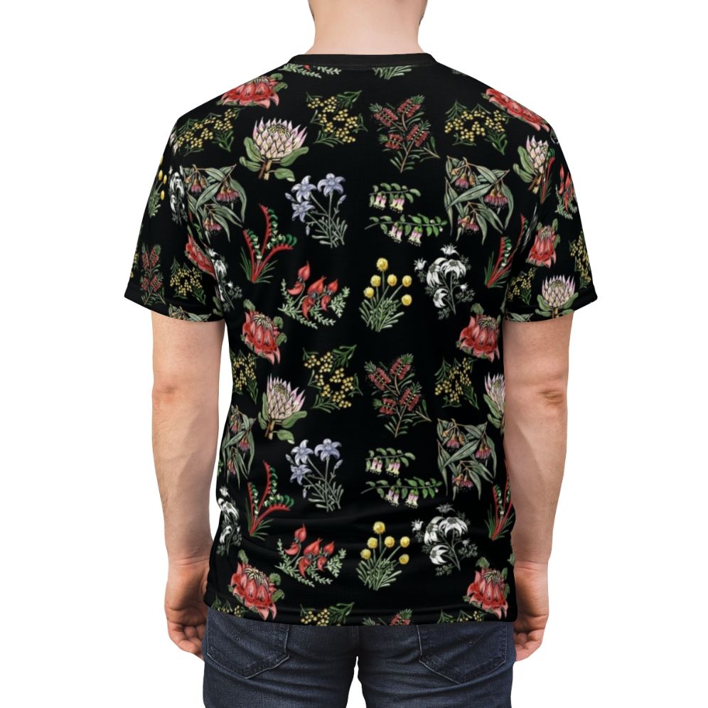 Lino print t-shirt featuring a colorful arrangement of native Australian flowers including wattle, flowering gum, and kangaroo paw. - men back