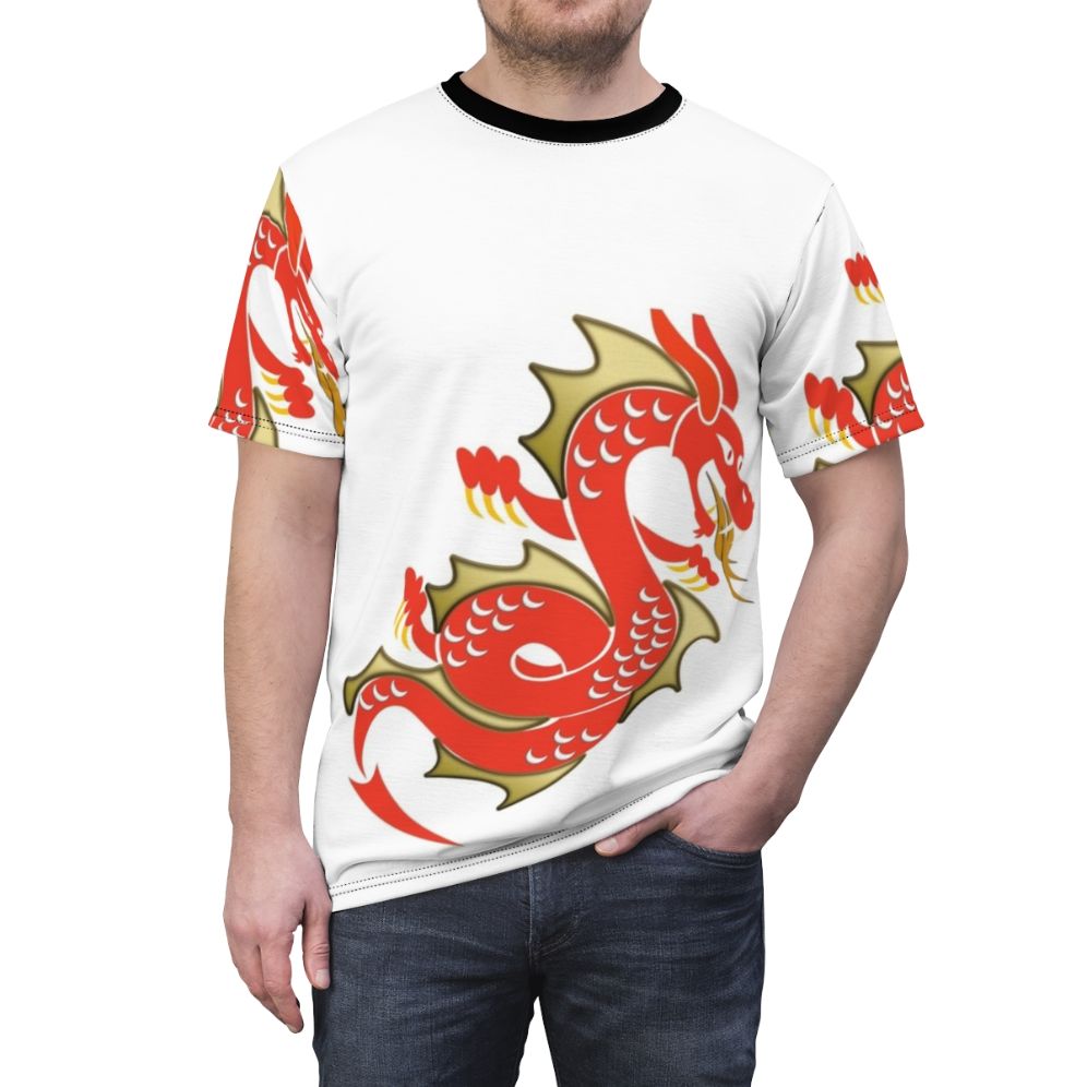 Model wearing a red t-shirt with a dragon design, a mystical and legendary creature from the film Raya and the Last Dragon. - men front