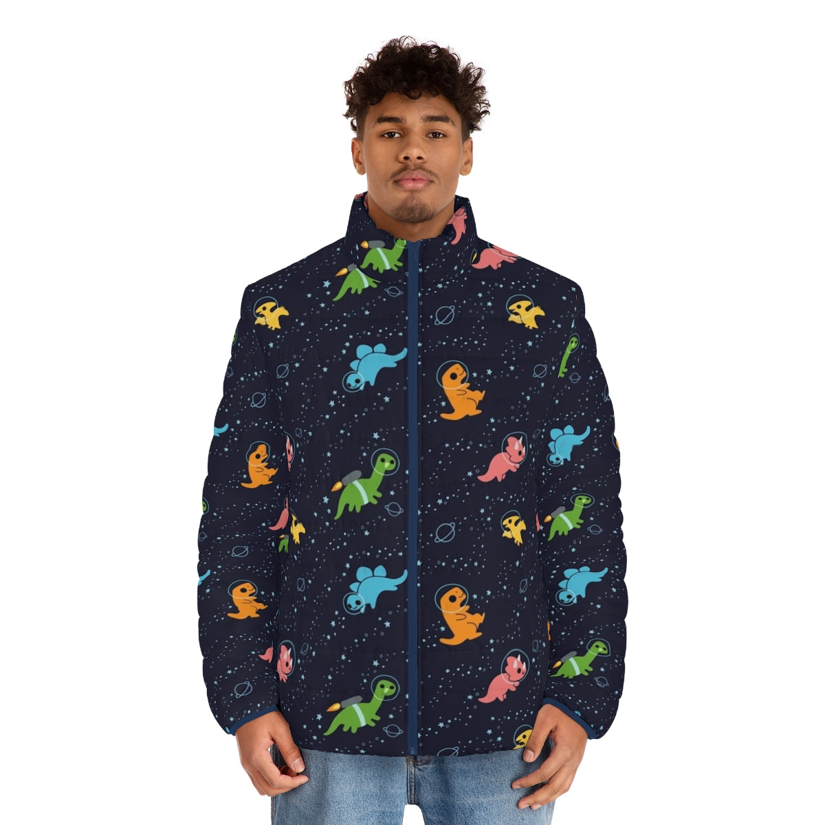 A puffer jacket featuring a whimsical pattern of dinosaurs floating in a galaxy of stars and planets. - men front