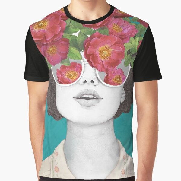 A surrealist graphic t-shirt featuring a woman's face with rose tinted glasses, surrounded by a watercolor floral design.