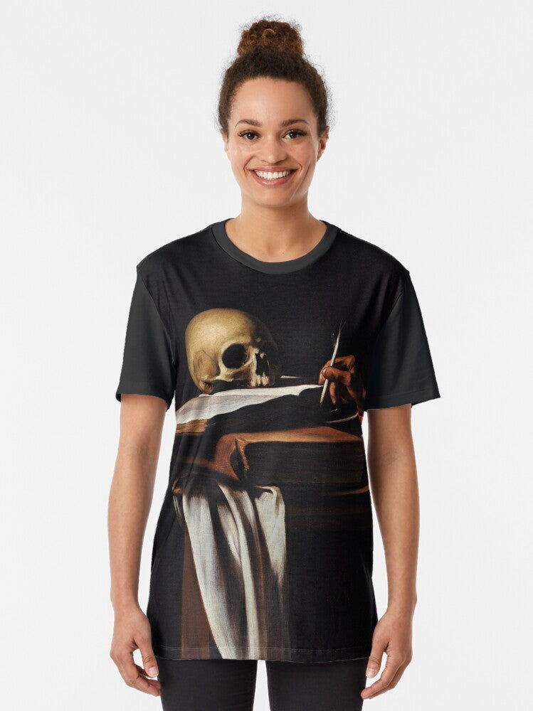 Baroque style graphic tee featuring Saint Jerome writing, a famous religious painting by the Italian artist Michelangelo Caravaggio. - Women