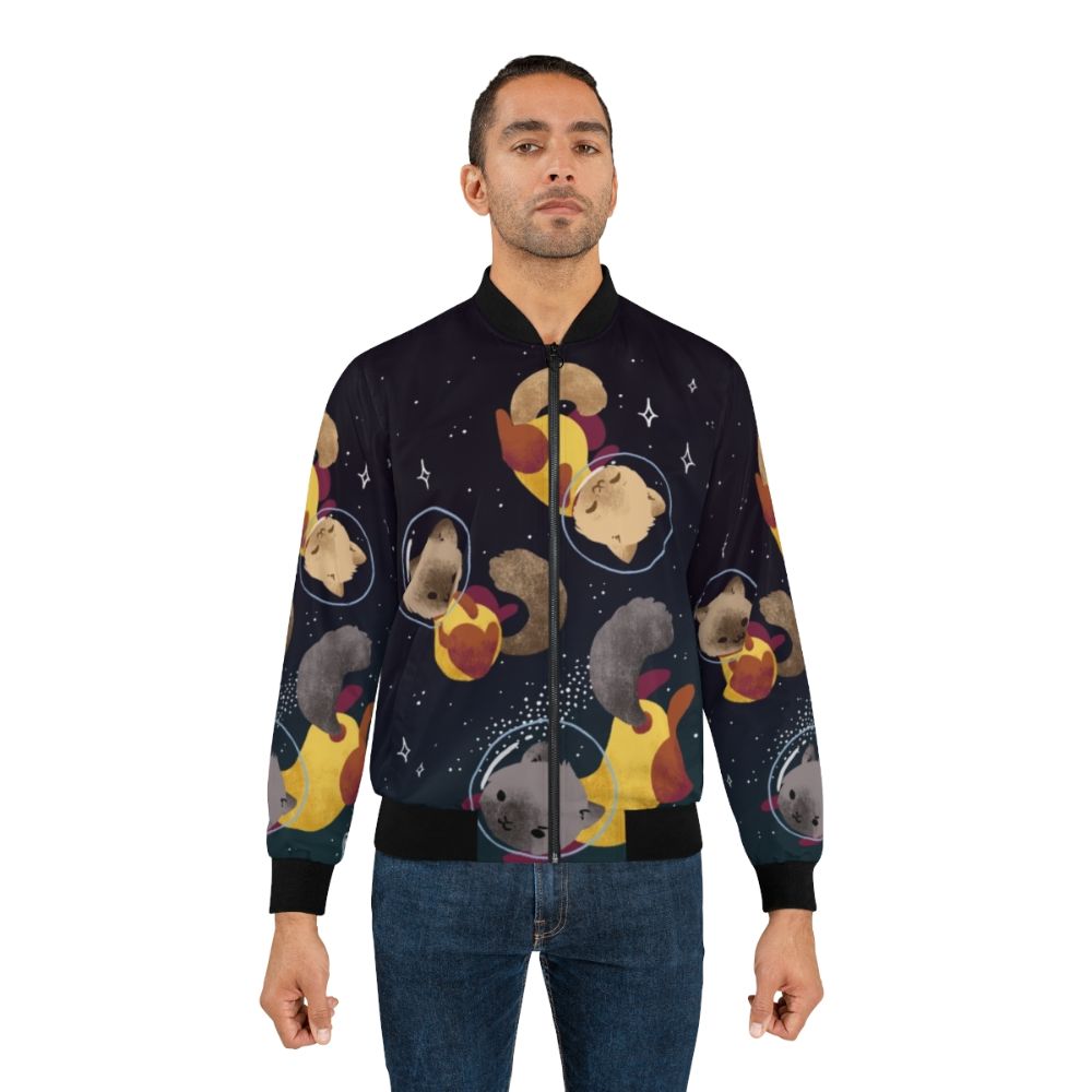 Cute and fun space cats illustration on a bomber jacket, featuring a cosmic design with stars, planets, and a playful feline astronaut. - Lifestyle