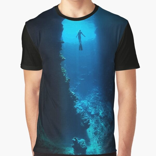 A graphic t-shirt featuring a free diver exploring the ocean