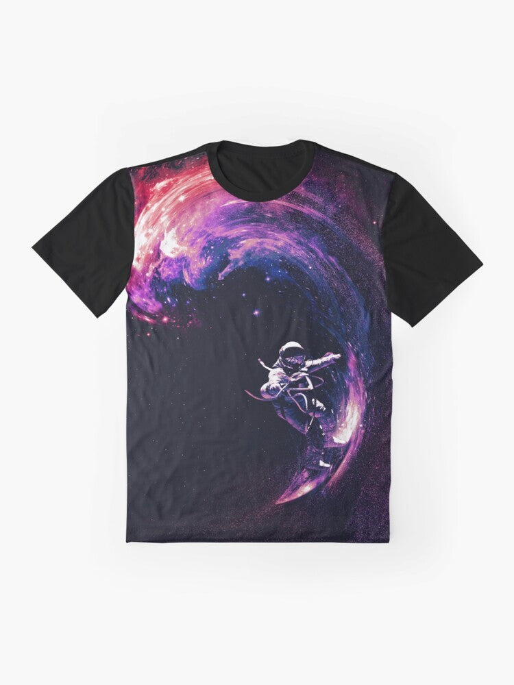 Cosmic space surfing graphic t-shirt with astronaut, galaxy, and stars design - Flat lay