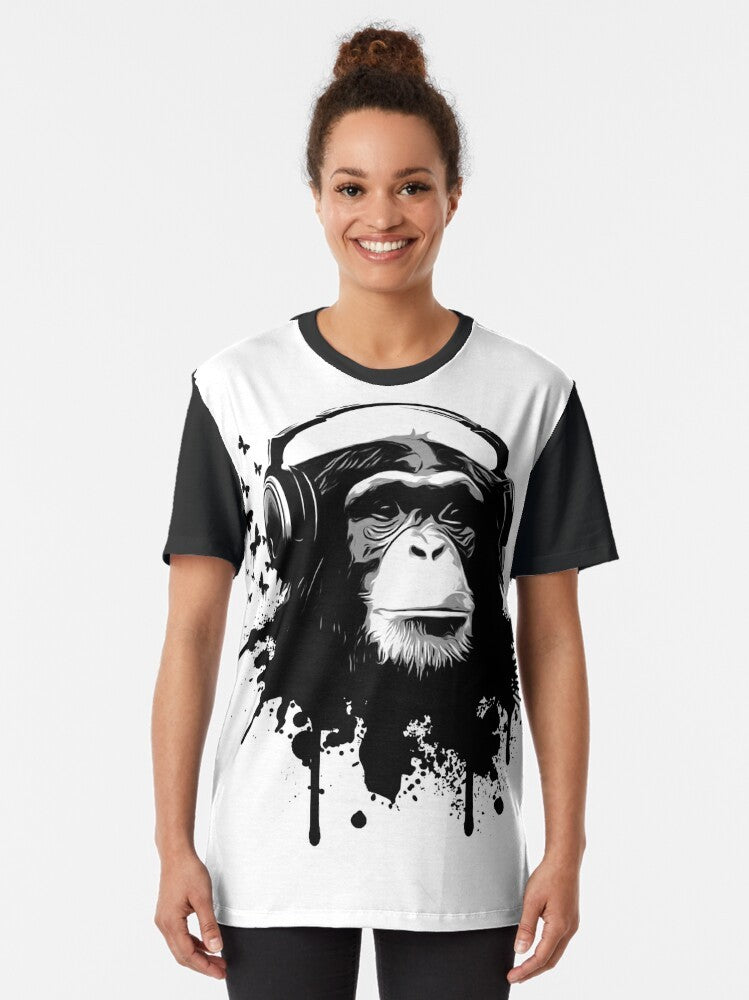 Monkey Business graphic t-shirt featuring a chimpanzee wearing headphones with a splash of butterflies and graffiti-style graphics - Women