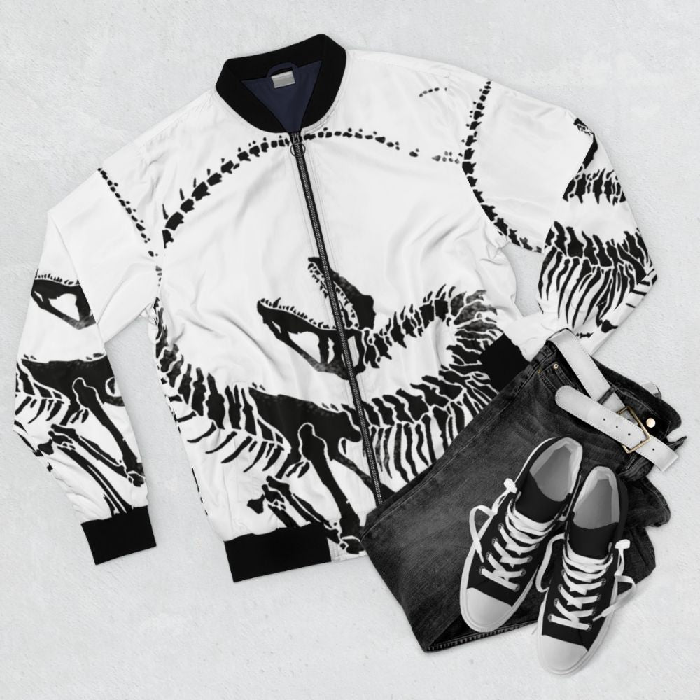 Velociraptor skeleton print on a black bomber jacket - Flat lay