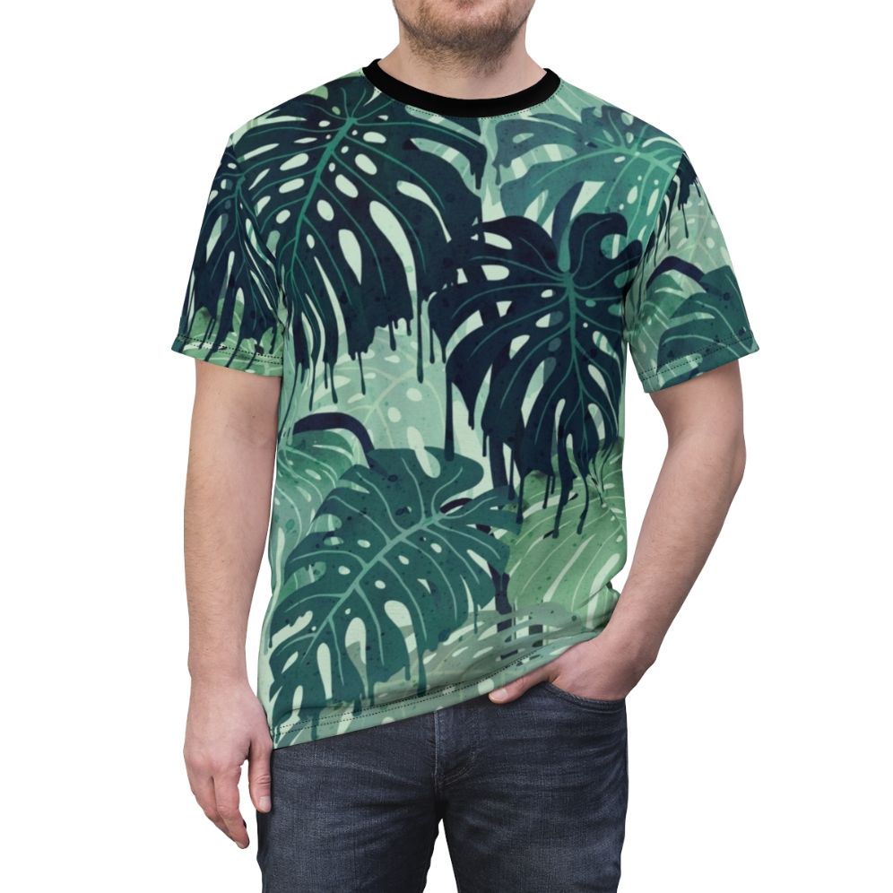 Closeup of a vibrant, tropical monstera leaf print on a t-shirt - men front