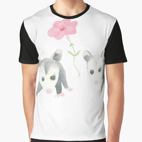 Adorable illustration of a baby opossum surrounded by pink petunias on a graphic t-shirt