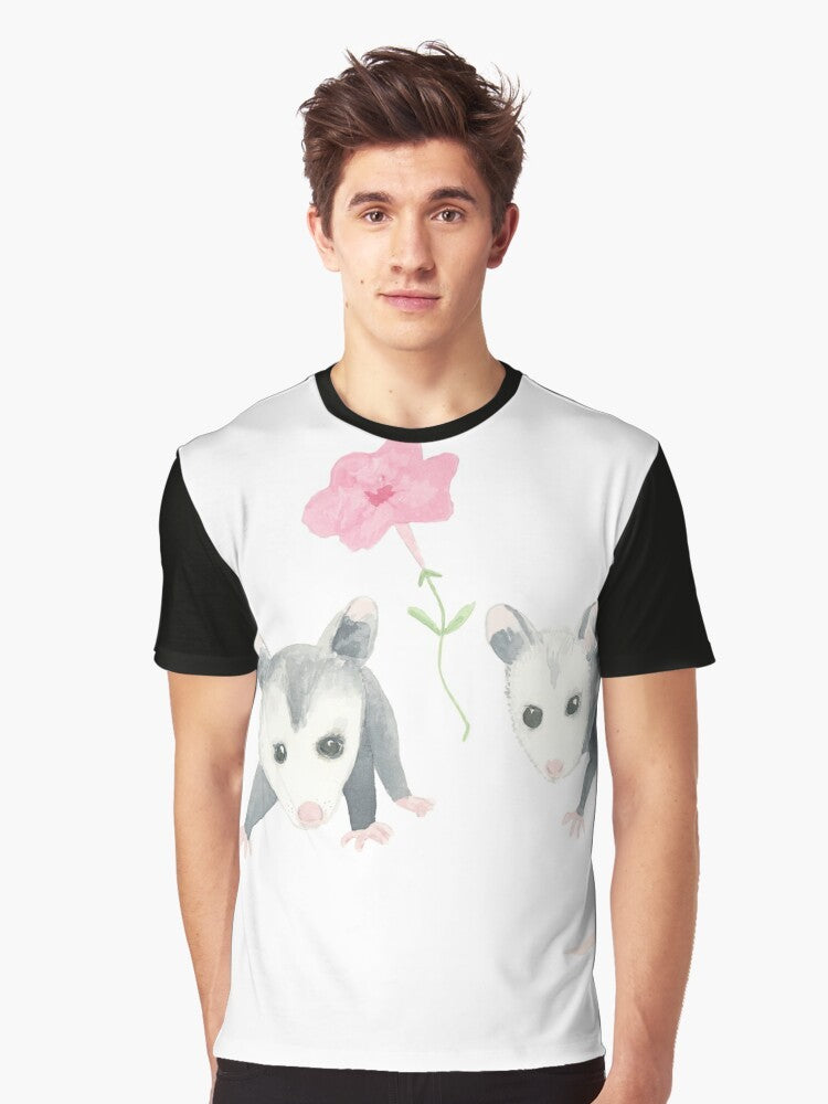 Adorable illustration of a baby opossum surrounded by pink petunias on a graphic t-shirt - Men