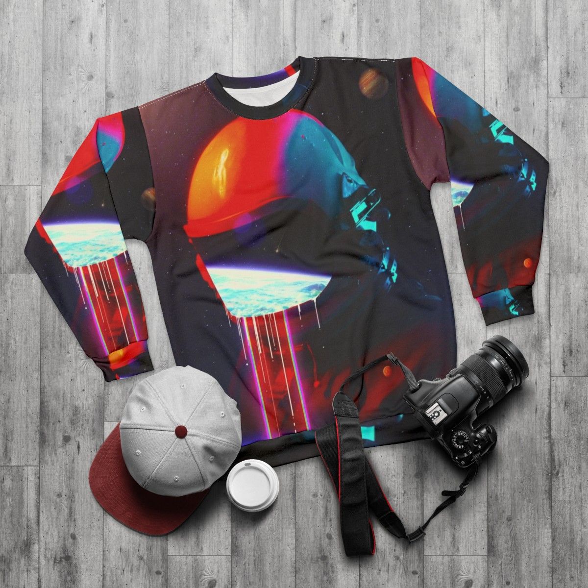 Cosmic leaking sweatshirt with surreal space exploration design - flat lay