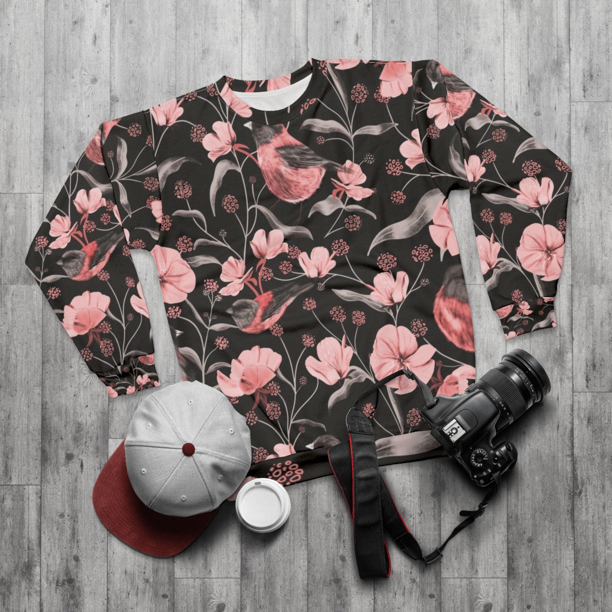 Pink birds and flowers botanical design on a sweatshirt - flat lay