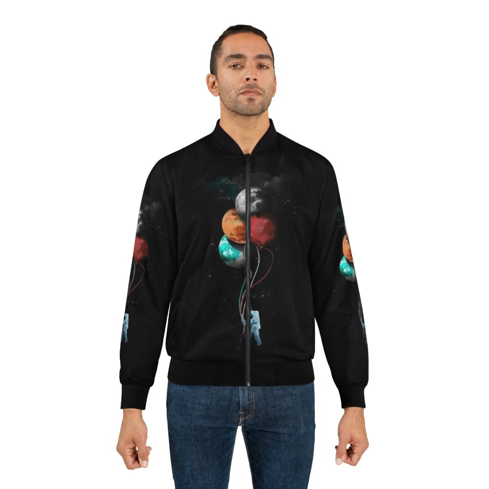 Spaceman's Cosmic Bomber Jacket with Planets, Balloons, and Surreal Elements - Lifestyle