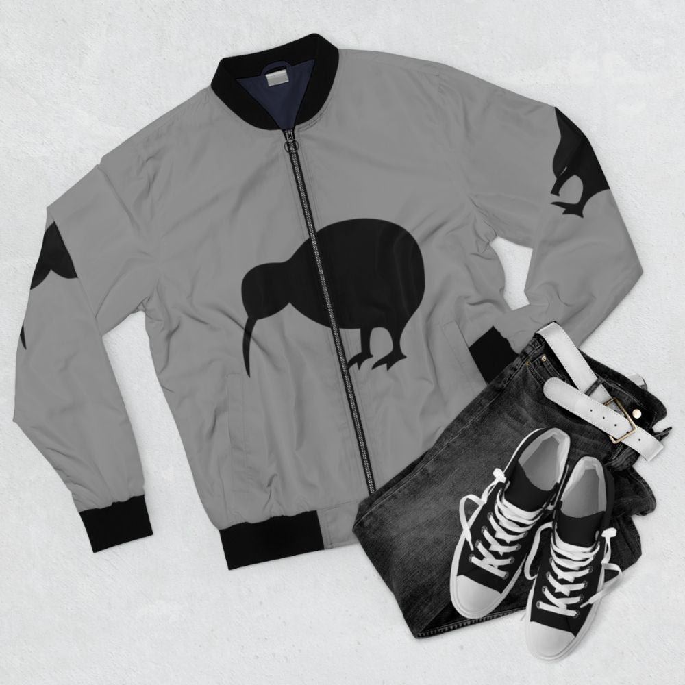 Black bomber jacket with kiwi and New Zealand design - Flat lay