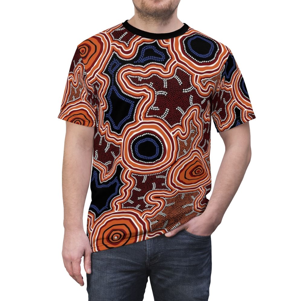 Authentic Aboriginal dot art painting depicting pathways to water on a high-quality t-shirt - men front