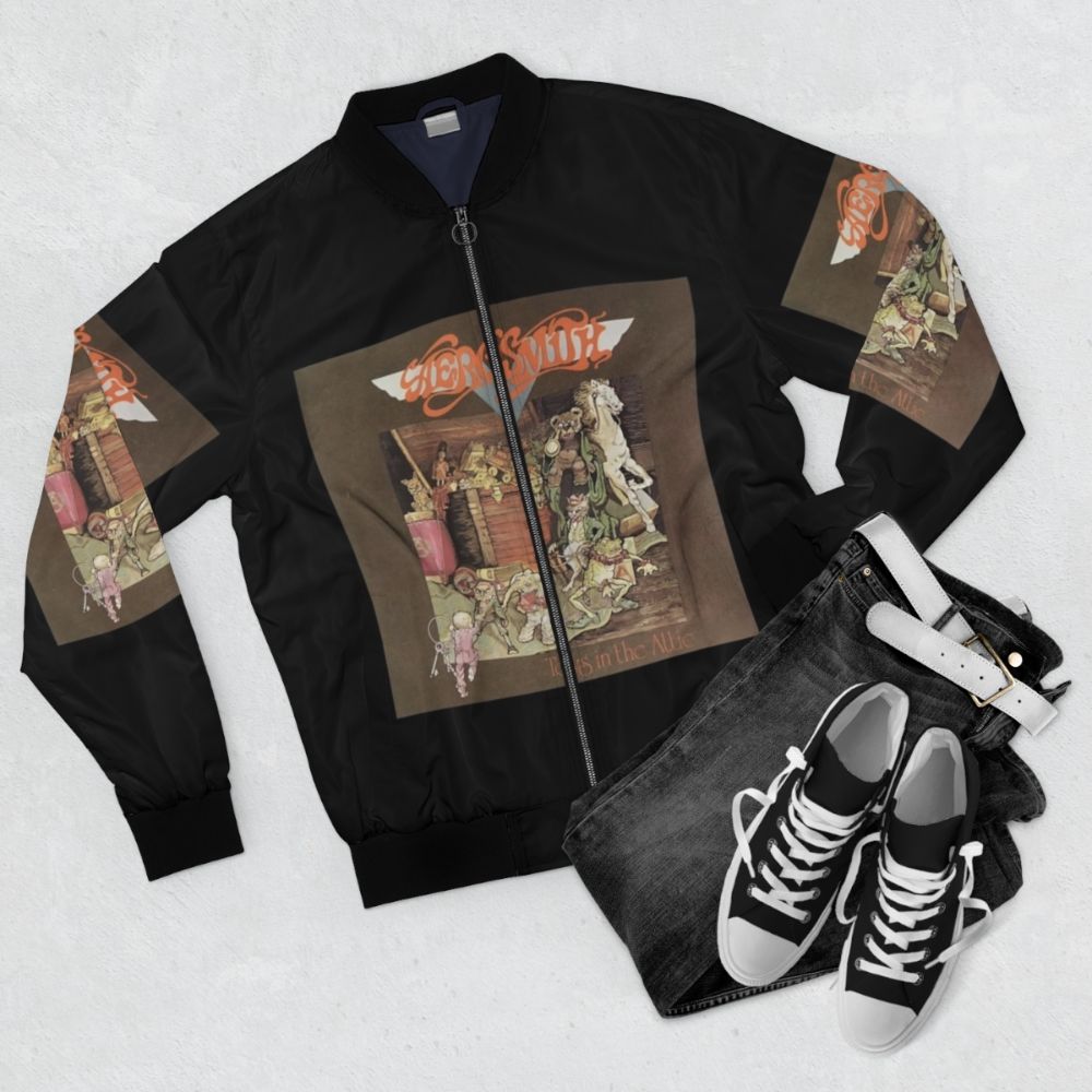 Bomber jacket with a graphic design of toys in a scary room - Flat lay