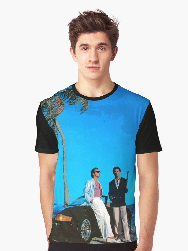 Retro Miami Vice inspired t-shirt featuring a blue graphic design with the words "Miami Vice" and characters Crockett and Tubbs from the 1980s TV series. - Men