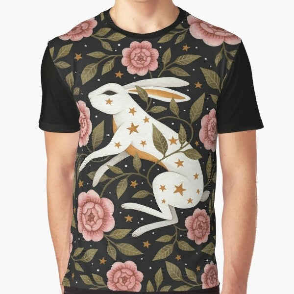 Graphic t-shirt featuring an entangled rabbit in a magical, floral landscape with stars and laurel