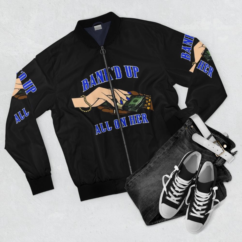 A blue and black bomber jacket with streetwear-inspired design - Flat lay