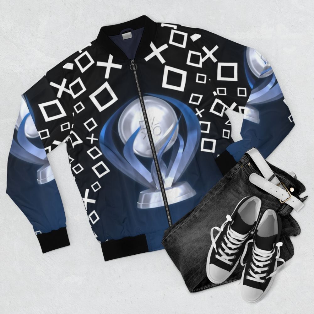 A black bomber jacket with a gaming trophy design - Flat lay