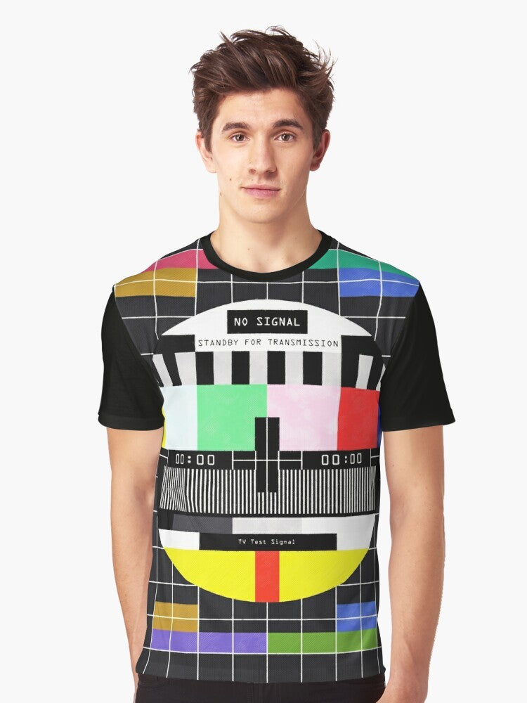 Graphic t-shirt design featuring a retro, glitchy "standby for transmission" message with vintage television and digital art elements. - Men