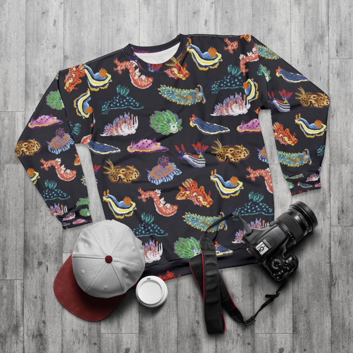 Colorful sea slug or nudibranch design on a sweatshirt - flat lay