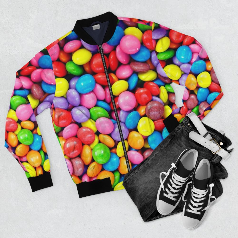 Colorful and vibrant bomber jacket with a rainbow and candy print design - Flat lay