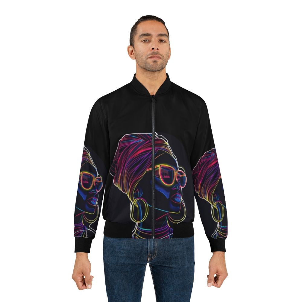 Radiant Queen Neon Bomber Jacket featuring a vibrant, glowing silhouette of an African woman in modern, artistic illustration style. - Lifestyle