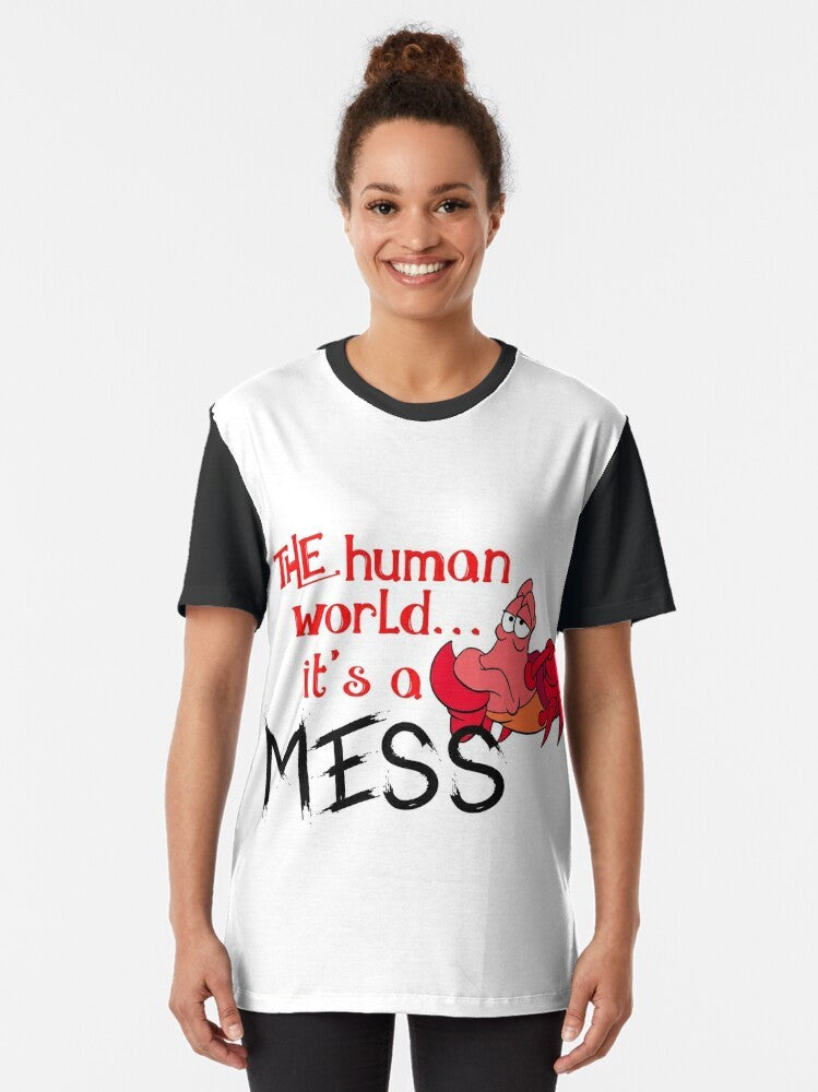 Graphic t-shirt design featuring a crab from The Little Mermaid and the text "The human world it's a mess" - Women