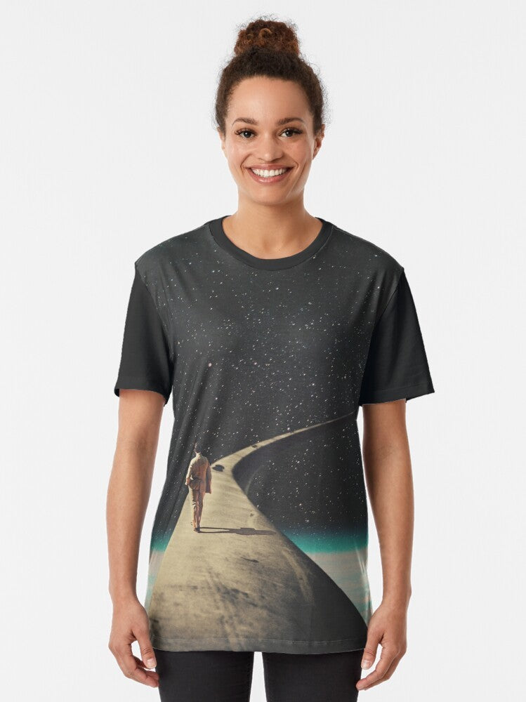 Vintage style graphic t-shirt featuring a surreal landscape with a lone wanderer on the road, symbolizing loneliness and the journey of life. - Women