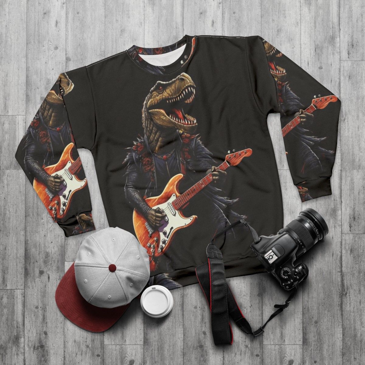 Dinosaur playing guitar illustration on a sweatshirt - flat lay