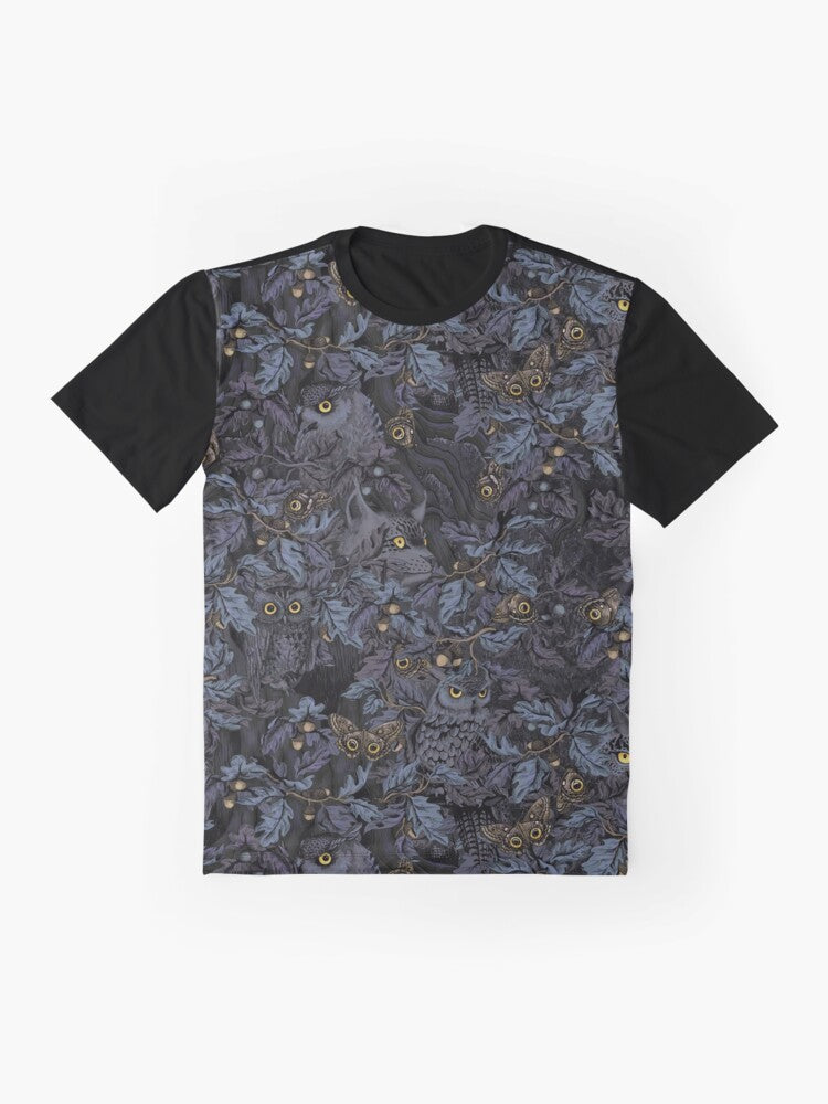 A graphic t-shirt featuring a camouflage pattern with owls, leaves, and moonlight imagery, capturing the beauty of nature's wilderness. - Flat lay