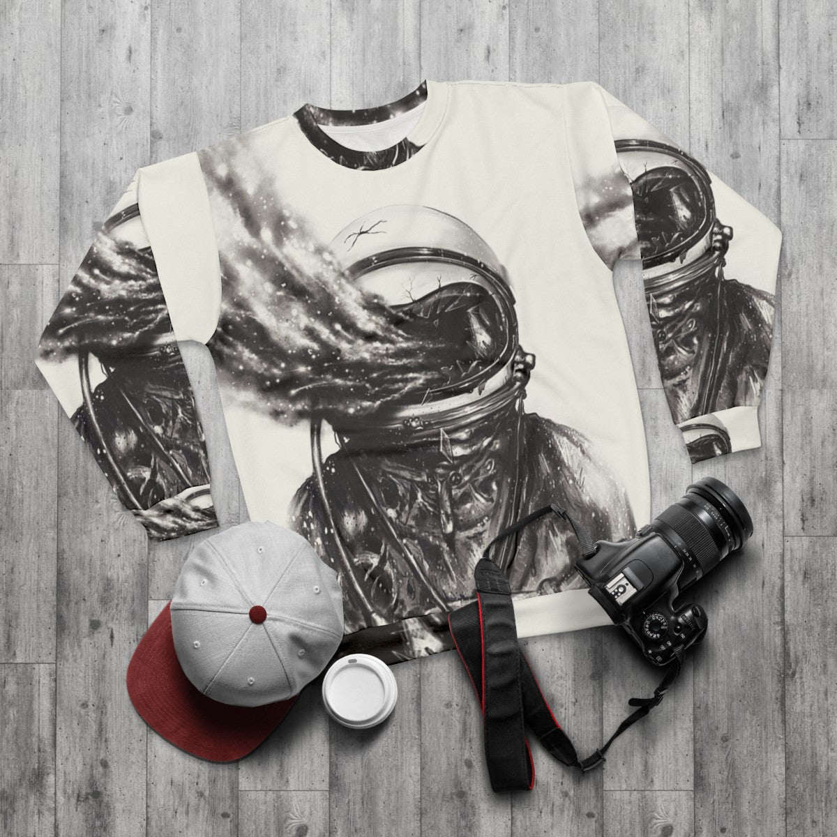 Transposed cosmic galaxy sweatshirt with surreal spaceman design - flat lay