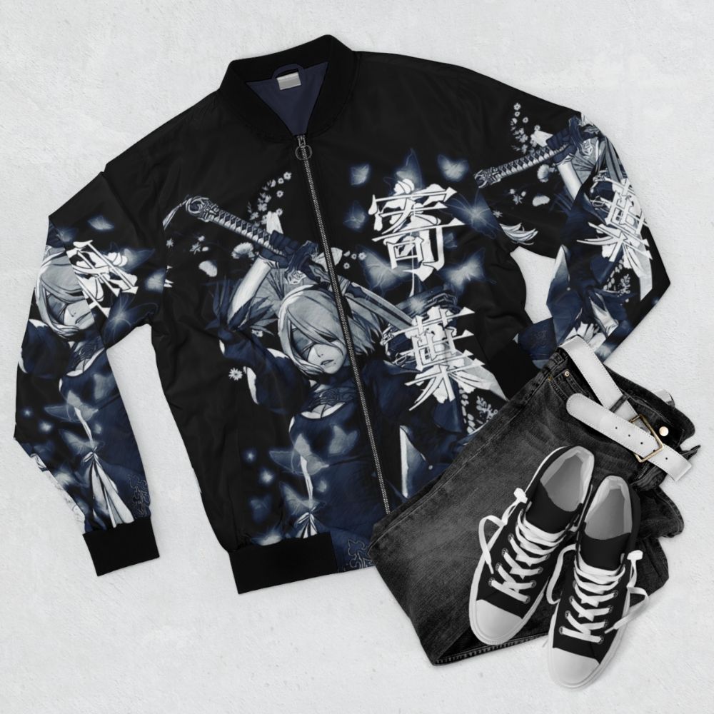 A blue bomber jacket with a floral and anime-inspired design, featuring flowers, butterflies, and Nier Automata characters. - Flat lay