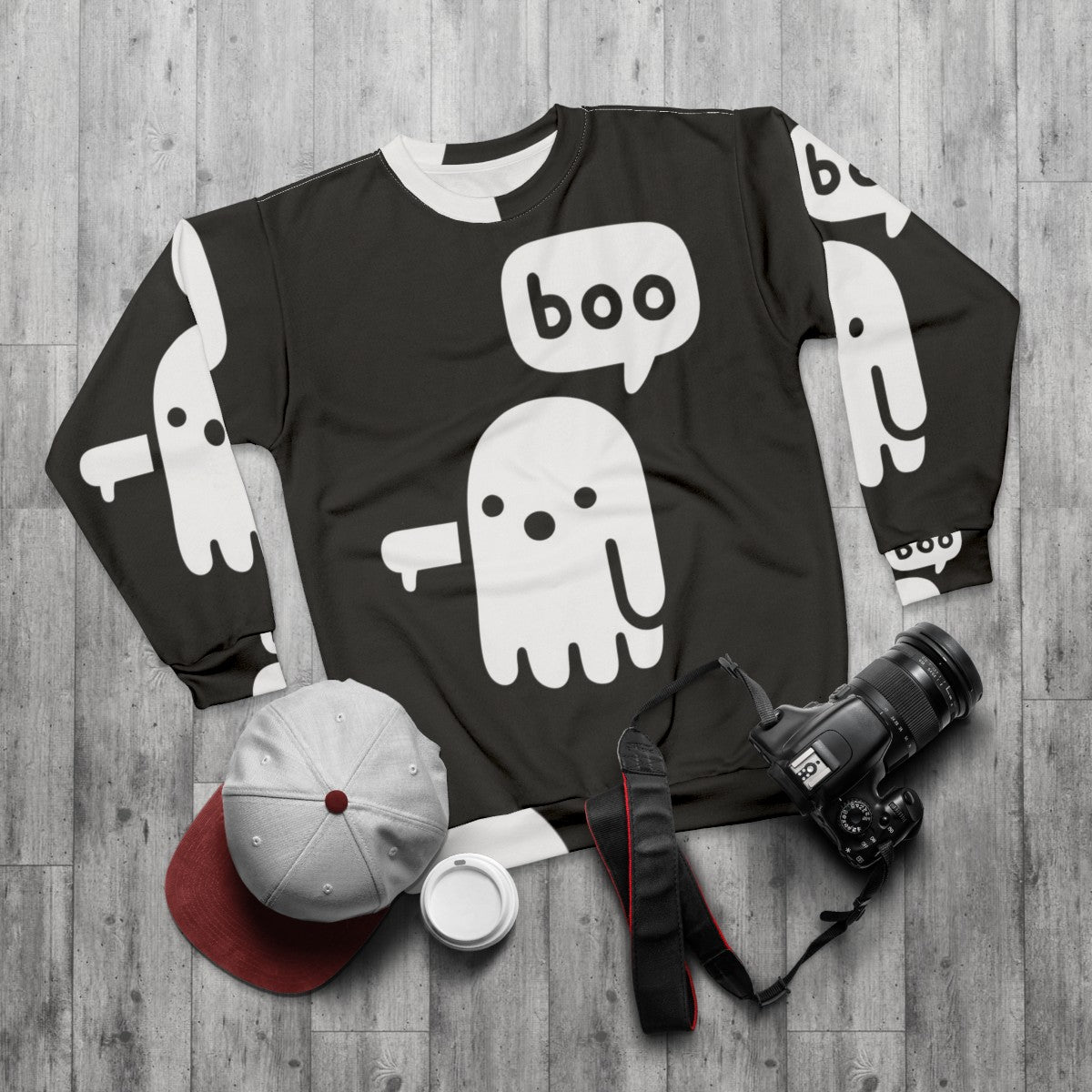 Spooky ghost graphic on a black sweatshirt - flat lay