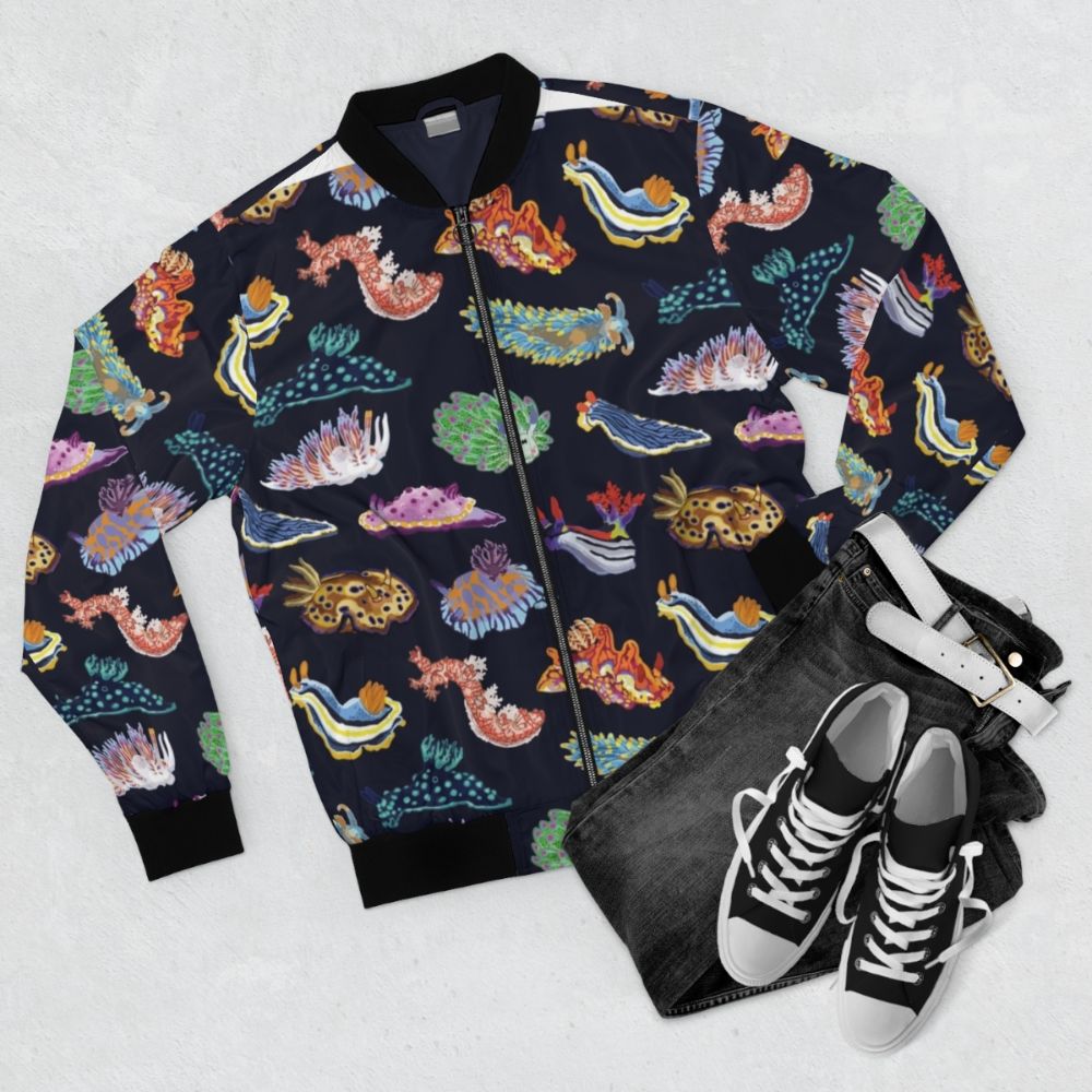 Colorful nudibranch sea slug printed on a bomber jacket, great for marine biology enthusiasts. - Flat lay