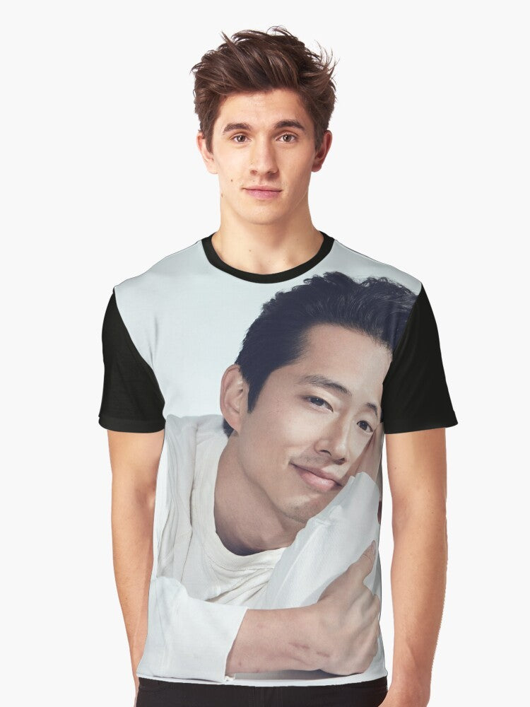 Steven Yeun, Korean actor known for The Walking Dead, wearing a graphic t-shirt - Men